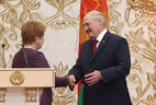 Lidia Yermoshina hands over the Certificate of the President of the Republic of Belarus to Alexander Lukashenko