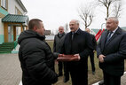 Alexander Lukashenko gives the mini tractor Belarus-132Н to the family-type children’s home in Buda-Koshelevo as a gift