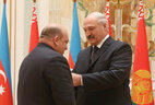 Belarus President Alexander Lukashenko presents the Order of Honor to Chairman of the Supervisory Board of Ganja Automobile Plant Khanlar Fatiyev