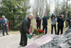 Alexander Lukashenko lays flowers at the monument in the Alley of Abandoned Villages in Slavgorod
