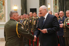 Alexander Lukashenko presents major-general’s straps to head of the Minsk Suvorov Military School Alexander Naumenko