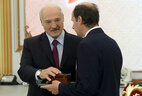 Nikolai Barulin, the head of the ichthyology and fish farming department at the Belarusian State Agricultural Academy, receives a letter of commendation from the President
