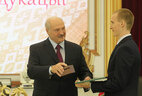 Pavel Builenkov, a graduate of the engineering faculty at the Belarusian State University of Transport, receives a commendation letter from the President