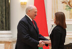Director of the National Book Chamber of Belarus Yelena Ivanova receives the Medal for Labor Merits