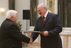 The official letter of thanks from the President of Belarus is presented to member of the presidium of the Belarusian public association of veterans Mikhail Shimansky