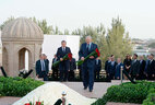 Alexander Lukashenko lays flowers at the tomb of Islam Karimov at the Hazrat Khizr cemetery. Those present observe a minute of silence to pay tribute to the first President of Uzbekistan