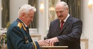The official letter of thanks from the President of Belarus is presented to chairman of the national council of the Belarusian Public Association of Veterans Anatoly Novikov
