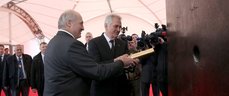 Alexander Lukashenko and Tomislav Nikolic are laying a time capsule in the foundation of the experimental multi-purpose complex Minsk Mir