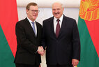 Belarus President Aleksandr Lukashenko and Ambassador Extraordinary and Plenipotentiary of Latvia to Belarus Einars Semanis