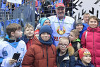 Aleksandr Lukashenko with young ice hockey fans