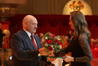 Olga Kurishko, a TV presenter for the ONT channel, receives a letter of commendation from the Belarusian President