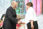 Alexander Lukashenko presents the award to director of the Bykhov psycho-neurological boarding house Zinaida Prokopovich