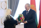 Alexander Lukashenko presents the Doctor of Art History diploma to Nadezhda Yuvchenko