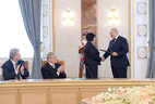 Alexander Lukashenko presents the Doctor of Chemistry diploma to Yelena Vorobyeva
