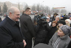 Alexander Lukashenko talks to people present at the ceremony