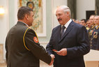 Major-general’s shoulder boards are presented to Sergei Novikov