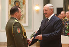 Major-general’s shoulder boards are presented to Igor Butkevich