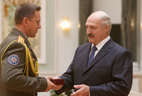 The Order for Service to the Motherland Third Class is presented to the head of supervision department of the Emergencies Ministry Colonel of Internal Service Vladimir Rafalsky