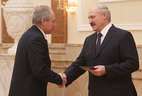 Alexander Lukashenko presents the diploma of the NASB academician to chairman of the scientific council – director of the executive board of the Belarusian national fund of fundamental research Sergei Gaponenko