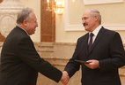Alexander Lukashenko presents the diploma of the NASB academician to director of the Belarusian Culture, Language and Literature Research Center of the NASB Alexander Lokotko