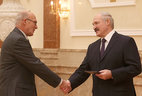 Alexander Lukashenko presents the diploma of the NASB academician to director of the Physical and Organic Chemistry Institute of the NASB Alexander Bildyukevich