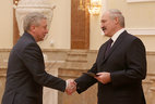 Alexander Lukashenko presents the diploma of the NASB member to Director General of the NASB United Institute of Informatics Problems Alexander Tuzikov