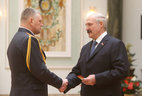 Alexander Lukashenko presents shoulder boards of major general of police to Viktor Senko
