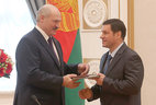 Alexander Lukashenko presents a diploma of the doctor of judicial sciences to head of the civil law and litigation chair of the Yanka Kupala Grodno State University Igor Martynenko