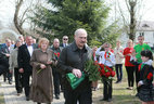 Alexander Lukashenko lays flowers at the monument in the Alley of Abandoned Villages in Slavgorod