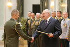 Graduate of the National Security Institute of the Republic of Belarus Senior Lieutenant Dmitry Rudnitsky receives an official letter of thanks from the President