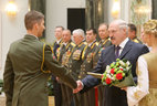 Graduate of the Military University of the Defense Ministry of the Russian Federation Major Alexander Shilin receives an official letter of thanks from the President