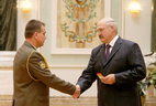 Alexander Lukashenko presents major general’s shoulder boards to Andrei Gurtsevich