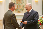 Alexander Lukashenko presents major general’s shoulder boards to Oleg Chernyshev
