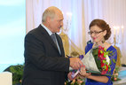 Anna Pilipchuk gets a letter of appreciation from the President