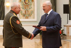 Alexander Gura, Defense Minister’s Aide for Ideology in the Armed Forces, Head of the Main Department for Ideology at the Belarusian Defense Ministry, receives the Order for Service to the Homeland 2nd Class