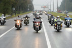 The President drives a Harley-Davidson at the head of the column of bikers from the Mound of Glory to Minsk