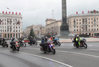 Alexander Lukashenko drives a Harley-Davidson at the head of the column of bikers in the Nezavisimosti Avenue