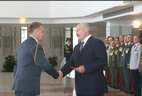Alexander Lukashenko presented shoulder straps of the major general of police to Vladimir Bachila