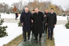 Turkey President Recep Tayyip Erdogan plants a tree near the Palace of Independence in Minsk