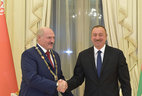 Azerbaijan President Ilham Aliyev awards the Order of Heydar Aliyev, the highest award of Azerbaijan, to Alexander Lukashenko