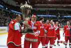 Sergei Stas and Alexander Lukashenko hold the Christmas Tournament Cup