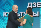 Special prize of the President is conferred on the team of authors of BelTA News Agency. Alexander Lukashenko presents the award to photo editor of the Visual Information Department Irina Bufetova