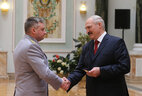 Alexander Lukashenko presents shoulder boards of major general of justice to Vladimir Shalukhin