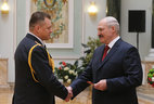 Alexander Lukashenko presents shoulder boards of major general of police to Vadim Sinyavsky
