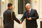 Alexander Lukashenko presents shoulder boards of major general of police to Alexander Kovalchuk