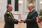 Defense attaché at the embassy of Belarus in Ukraine Sergei Maiko is honored with the Order for Service to the Homeland 3rd Class