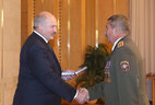 Head of the interior forces department of the Belarusian Military Academy colonel Igor Naumenko is decorated with the Service to the Homeland 2nd Class