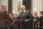 Graduate of the Combined Arms Academy of the Armed Forces of the Russian Federation Pavel Sak receives a letter of commendation from the President