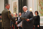 Graduate of the Senior Staff Training Department of the Civil Protection Ministry of the Emergencies Ministry Sergei Sobol receives a letter of commendation from the President