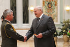 Alexander Lukashenko presents major general’s shoulder boards to Gennady Lepeshko